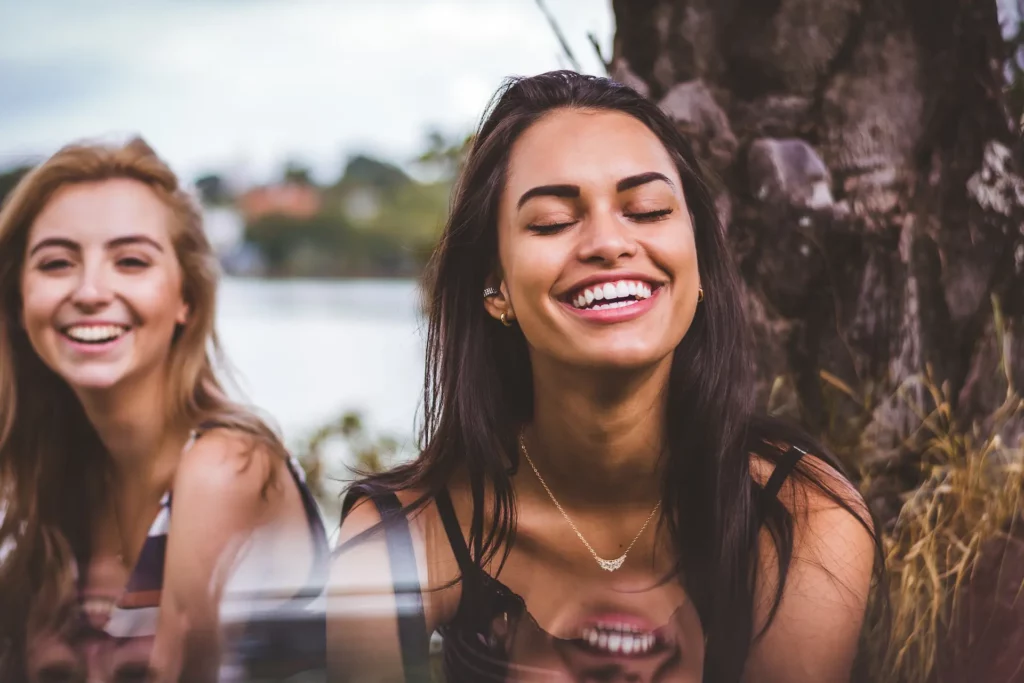 two woman smiling